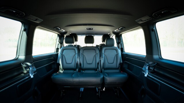 Wide angle shot of the rear facing seats in a Mercedes V-class